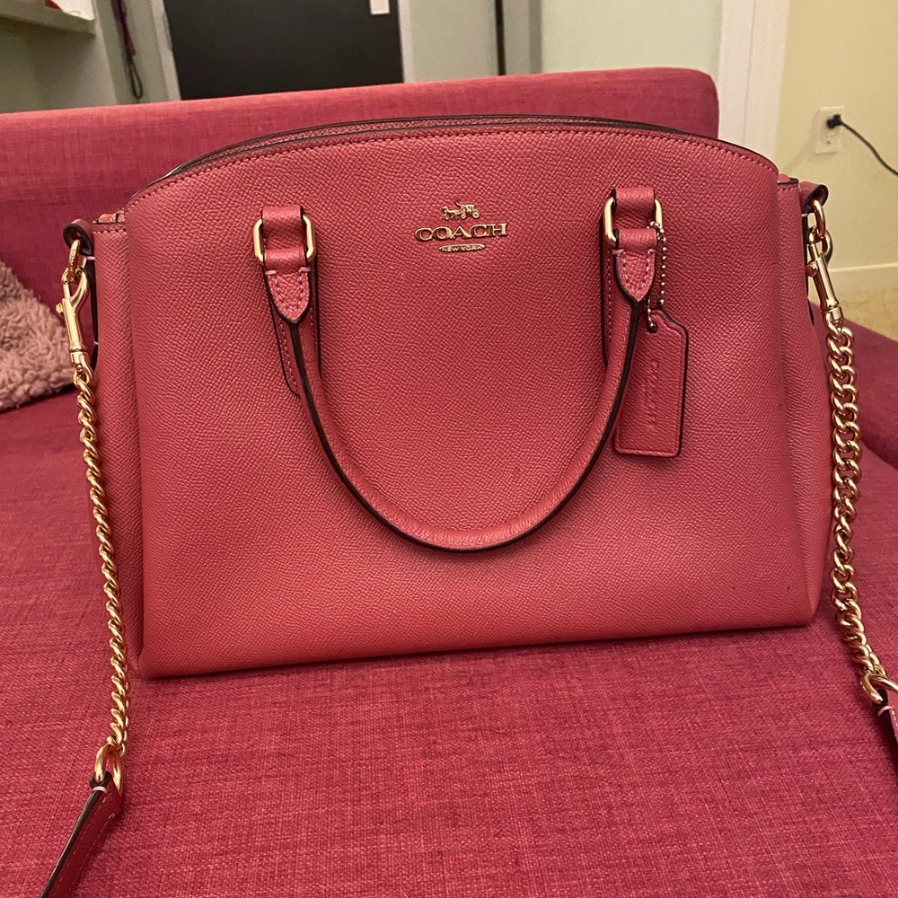 A beautiful bright pink coach bag